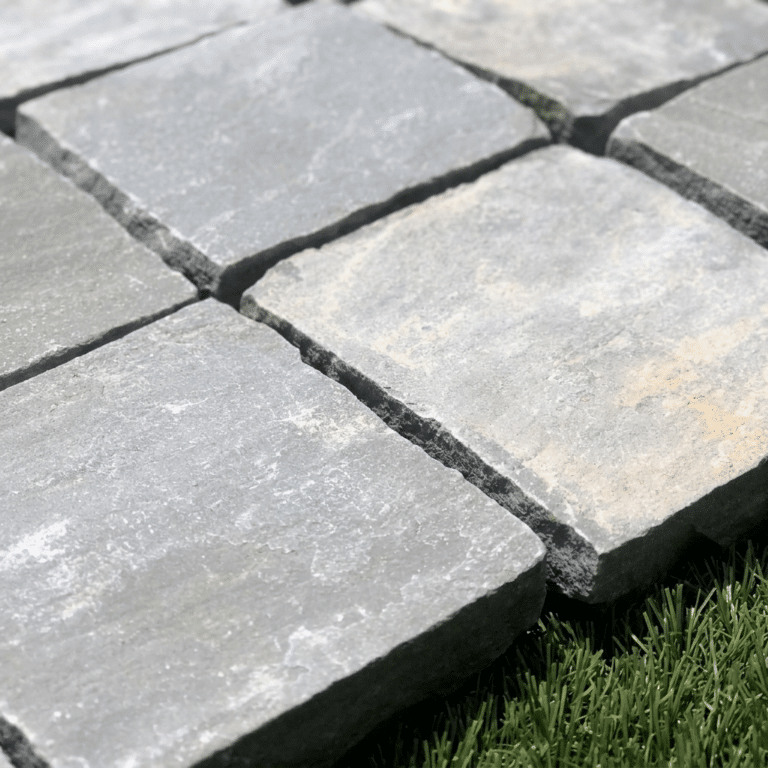 Close-up of Kandla Grey Indian sandstone cobble setts, 100 x 100 mm, natural grey stone