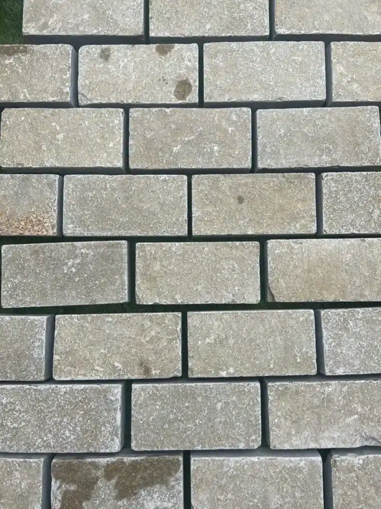 Yellow limestone sawn and tumbled cobble setts, 200 x 100 x 40 mm, warm yellow tones