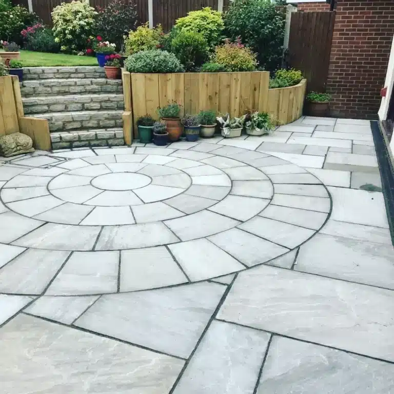 Kandla Grey Indian sandstone paving circle, natural grey tones, riven stone